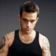 Robbie Williams prêt à représenter la Russie à l'Eurovision 12